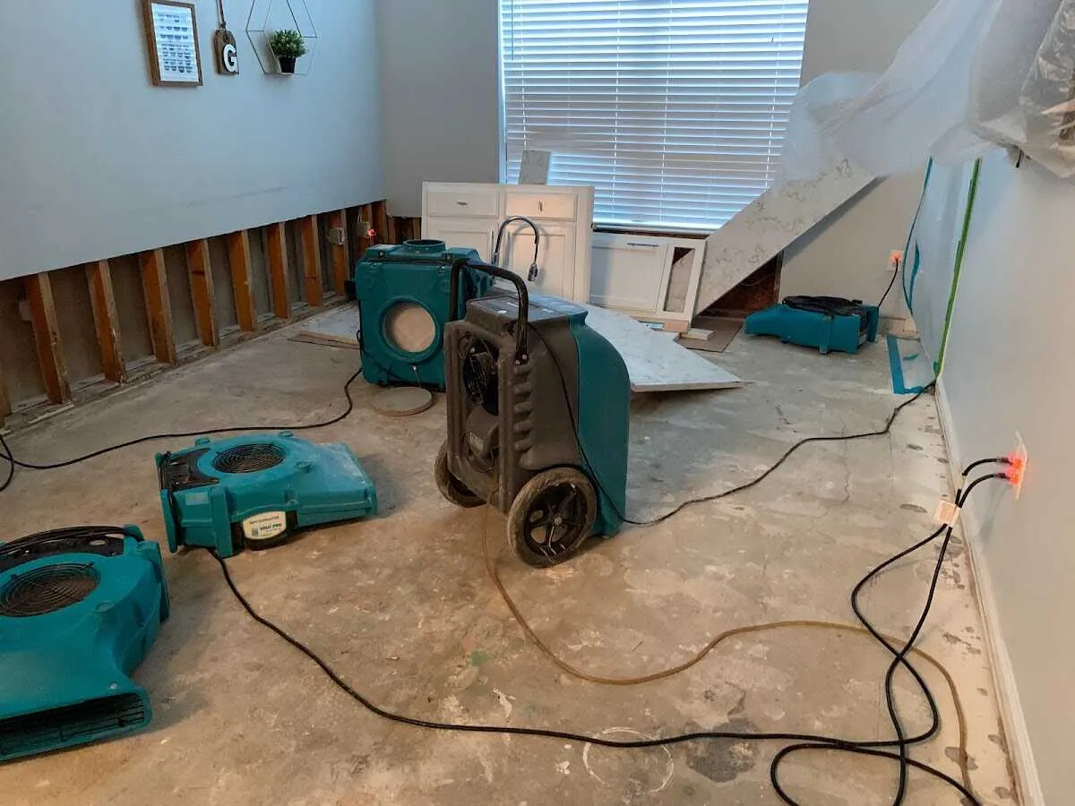 Dehumidifier in flood-cut room for Water Damage Restoration in Aurora